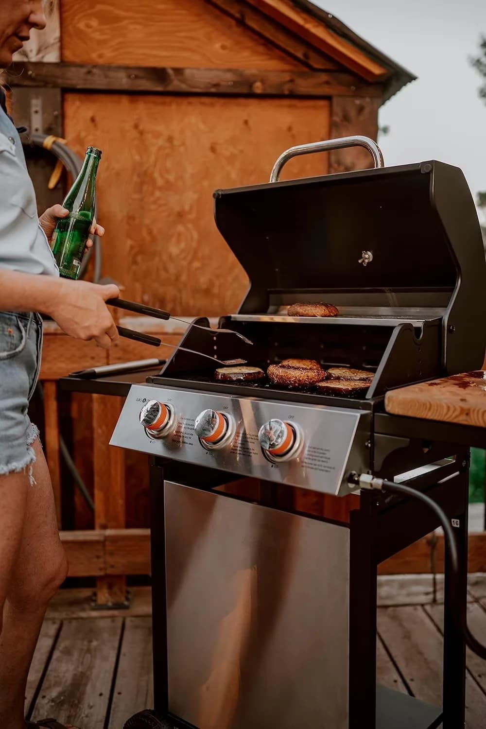 Versatile Gas Grill with Storage Rack, Wheels-High-Temperature Paint - Black Stainless Steel Model D8837E